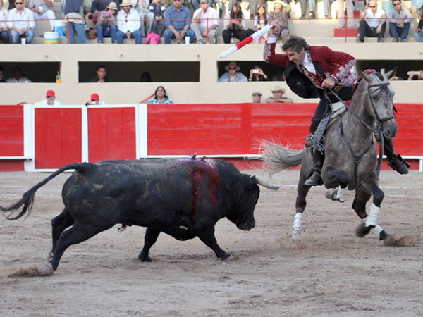 Larga en la boca del riego